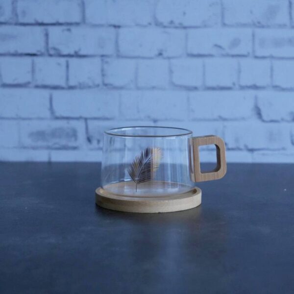 فروش فنجان پیرکس آنتی شوک طرح برگ همراه نعلبکی بامبو در فروشگاه تنها پیشتازان